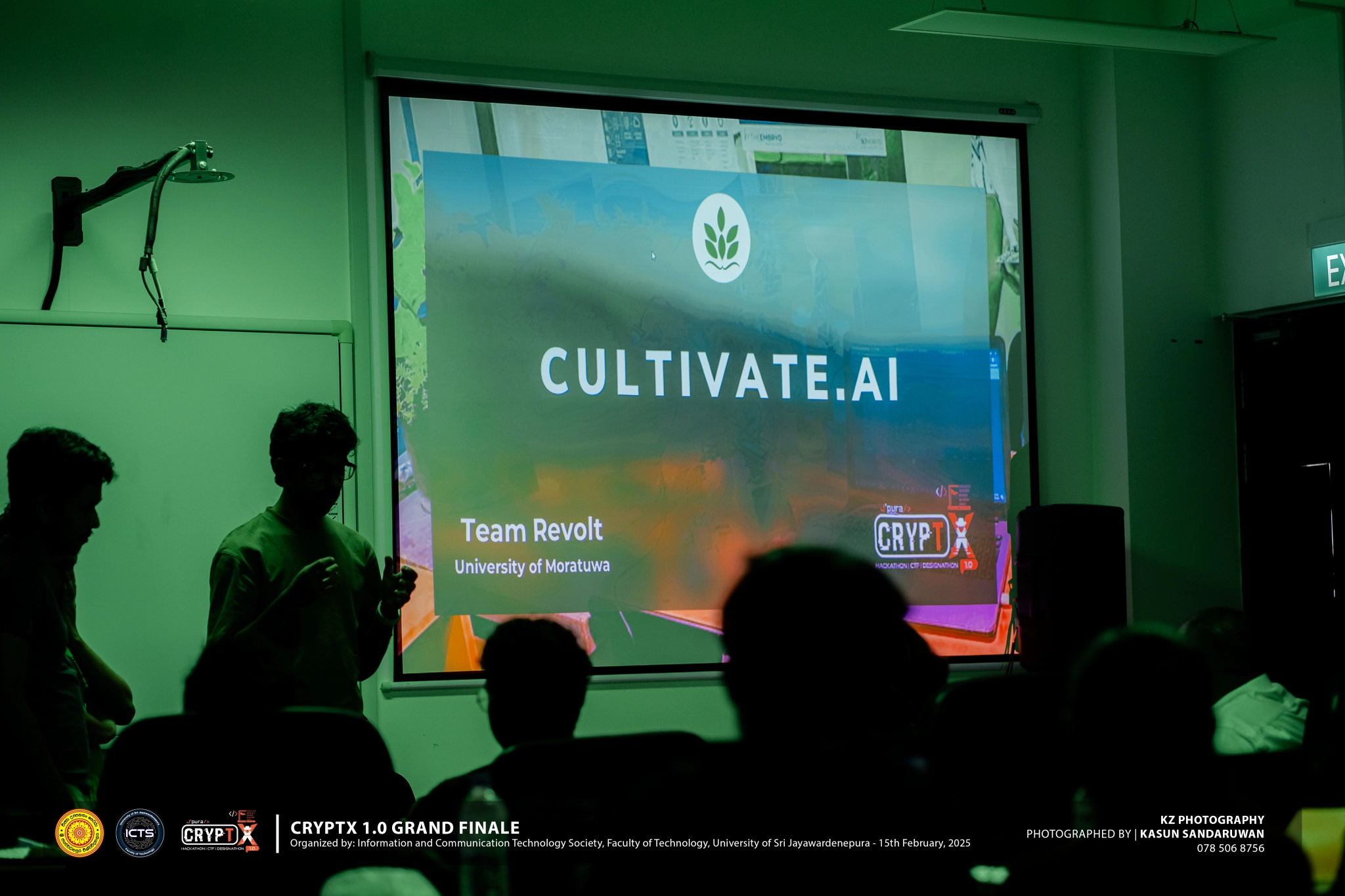 Hackathon participants collaborating on laptops